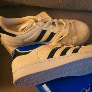Adidas white snakeskin superstar shell tops.